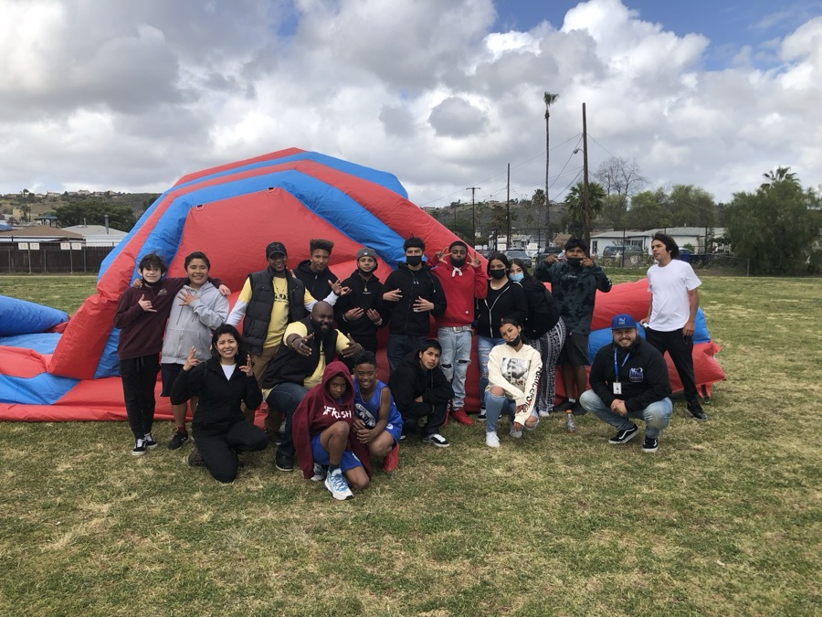 Joe Smith with local youth at a community field day