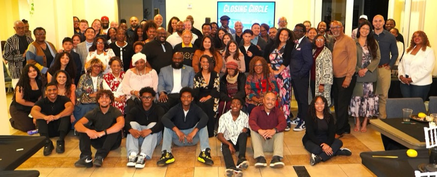 Large group of community members at the Closing Circle event