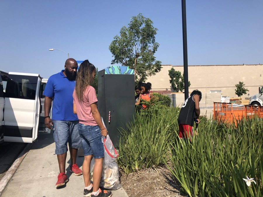 Joe Smith helping with a neighborhood cleanup