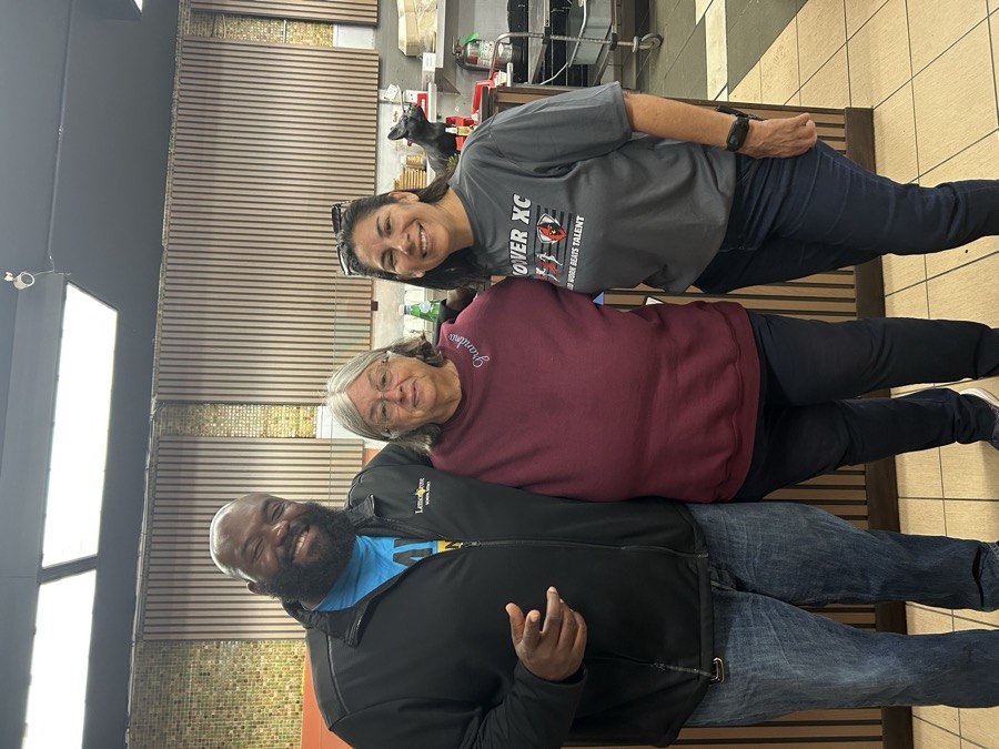 Joe Smith with two community members at a local business