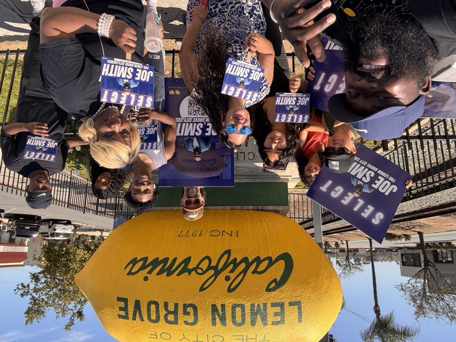 Joe Smith and supporters with Select Joe Smith signs at the Lemon Grove lemon