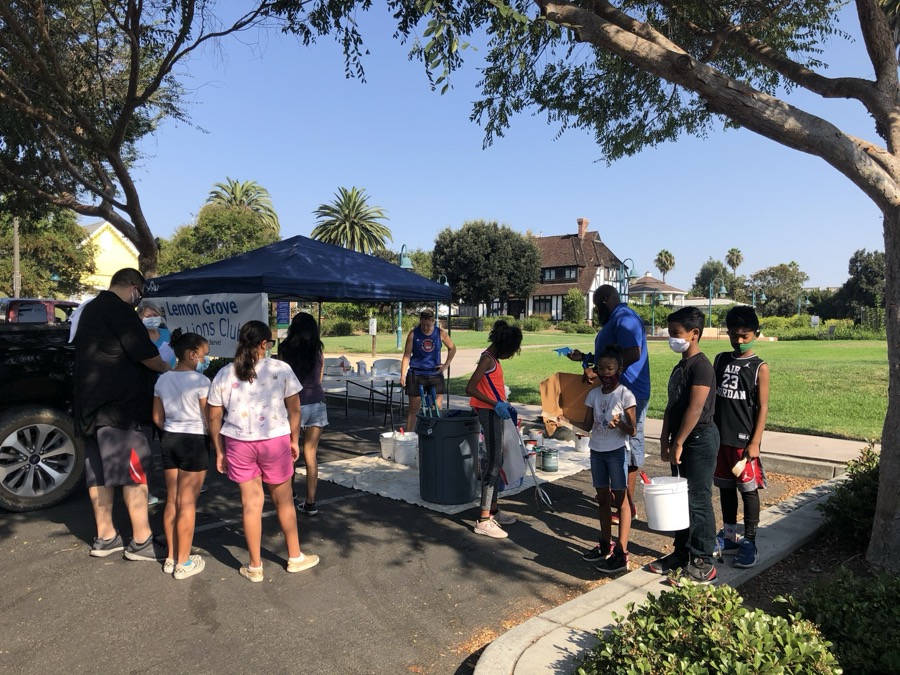 Neighbors gathering at a park outreach event