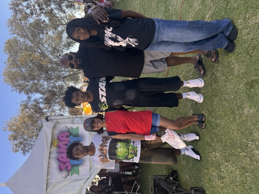 Joe Smith with young people at an outdoor festival